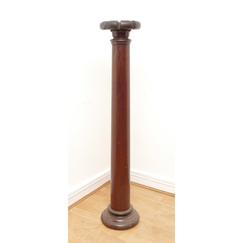 441 - A 19th century mahogany torchiere, with carved surmount, plain tapering column, 139cm