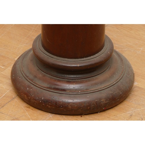 441 - A 19th century mahogany torchiere, with carved surmount, plain tapering column, 139cm