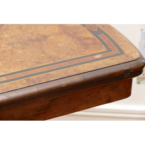 442 - A Victorian burr walnut, ebonised and boxwood fold over games table, with red leather insert, raised... 