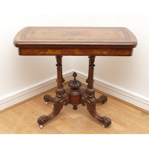 442 - A Victorian burr walnut, ebonised and boxwood fold over games table, with red leather insert, raised... 