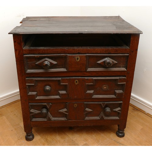 459 - A late 17th century oak chest of drawers, comprising four long graduated drawers (lacking top one) e... 