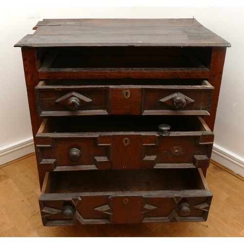 459 - A late 17th century oak chest of drawers, comprising four long graduated drawers (lacking top one) e... 