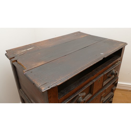 459 - A late 17th century oak chest of drawers, comprising four long graduated drawers (lacking top one) e... 