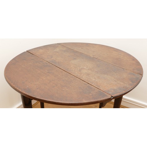 460 - An 18th century and later mahogany gateleg table, the top of circular form, raised on four tapering ... 