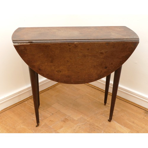 460 - An 18th century and later mahogany gateleg table, the top of circular form, raised on four tapering ... 