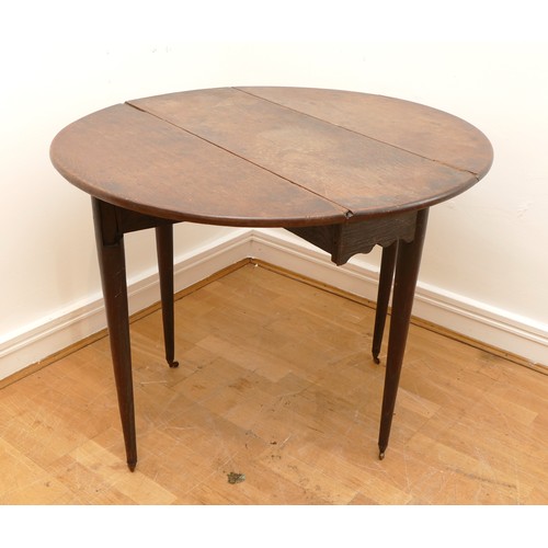 460 - An 18th century and later mahogany gateleg table, the top of circular form, raised on four tapering ... 