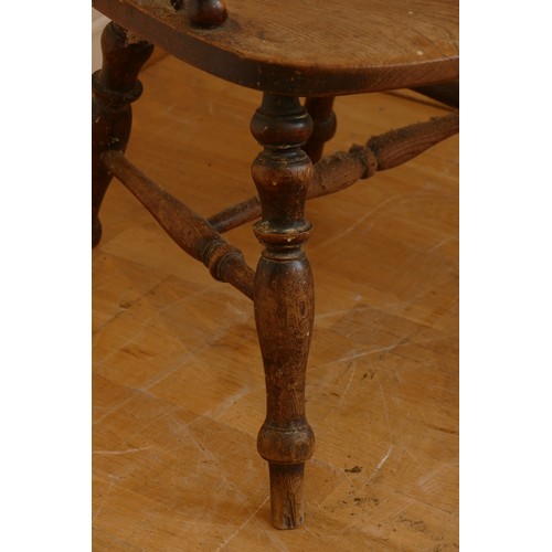 462 - A late 19th century oak and elm windsor chair, having stick and hoop back, outswept armrests support... 