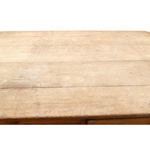 465 - A 19th century rectangular country kitchen table having five plank top with moulded frieze, two draw... 