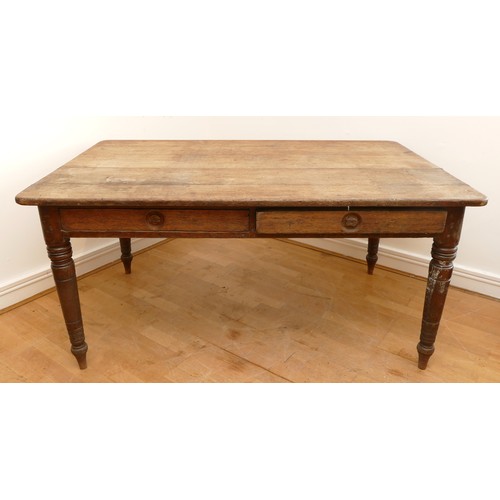 465 - A 19th century rectangular country kitchen table having five plank top with moulded frieze, two draw... 