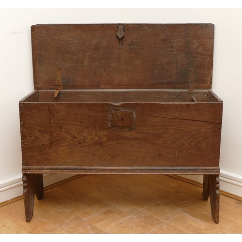 470 - An 18th century oak six plank chest or coffer, rectangular hinged top with carved rails, end boards ... 