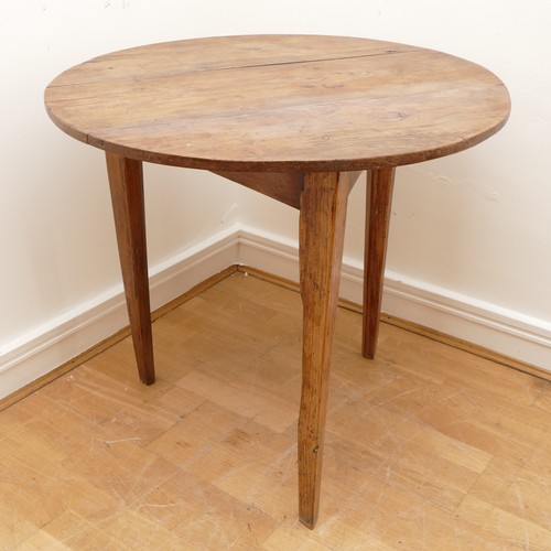 473 - A 19th Century pine cricket table, the circular top on three splayed and moulded square supports, 78... 