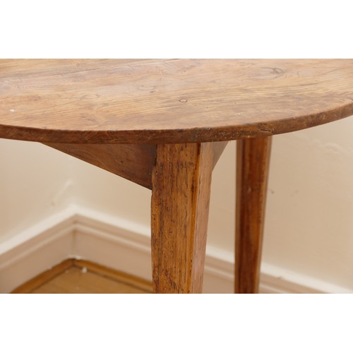 473 - A 19th Century pine cricket table, the circular top on three splayed and moulded square supports, 78... 