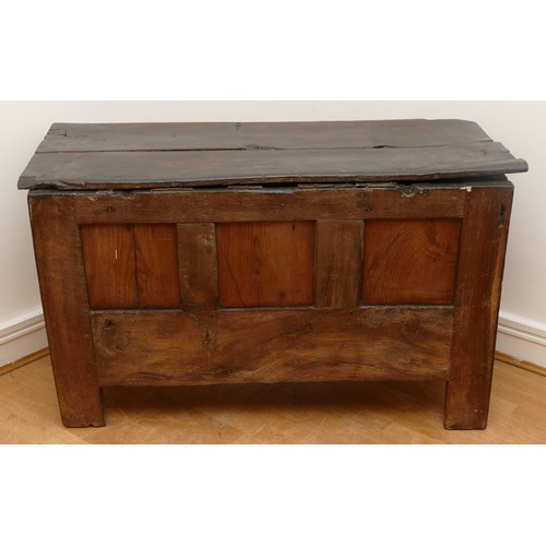 479 - A 17th century oak coffer, with plank top and loop hinges, three blind carved and moulded panels, ra... 