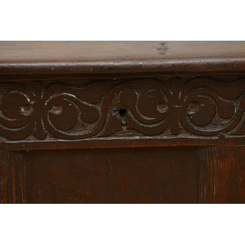 479 - A 17th century oak coffer, with plank top and loop hinges, three blind carved and moulded panels, ra... 