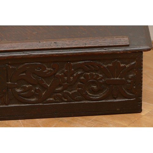 484 - A 17th century oak bible box, the rectangular iron hinged top over carved front with central wrought... 