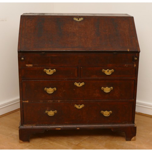 487 - A late 17th/early 18th century walnut bureau, veneered with cross banding, the overhanging slope wit... 