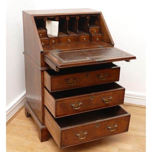 490 - A 19th century walnut bijou bureau, the drop leaf revealing fitted compartments, over two short and ... 