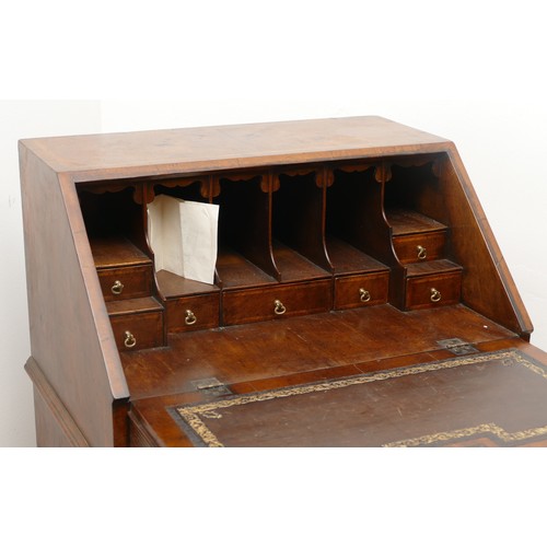 490 - A 19th century walnut bijou bureau, the drop leaf revealing fitted compartments, over two short and ... 