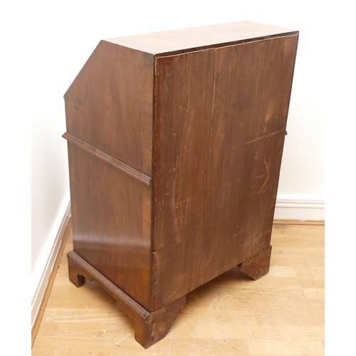 490 - A 19th century walnut bijou bureau, the drop leaf revealing fitted compartments, over two short and ... 