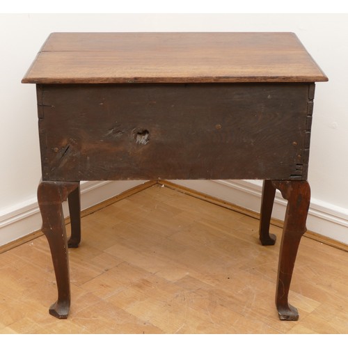 491 - A George III oak lowboy, having three frieze drawers and shaped apron, raised on cabriole legs with ... 