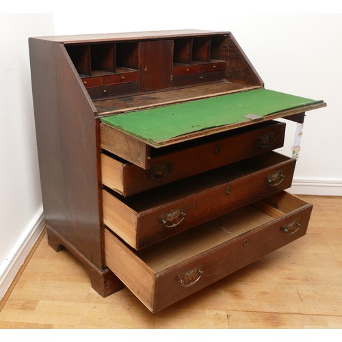 492 - A late 18th century oak bureau, the fall front opening to fitted interior, over two short and three ... 