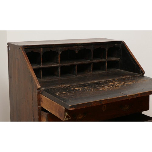 493 - A 17th century and later oak bureau, the sloping fall front enclosing a fitted interior with various... 