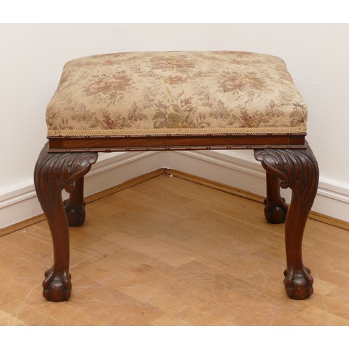 498 - A large 19th century mahogany stool, having tapestry seat on cabriole supports with claw and ball fe... 