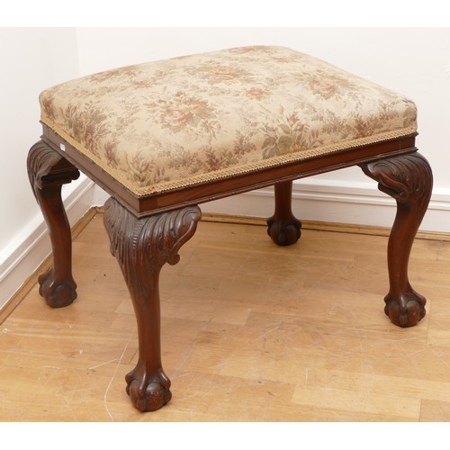 498 - A large 19th century mahogany stool, having tapestry seat on cabriole supports with claw and ball fe... 