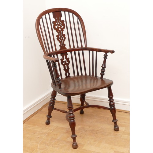 499 - A yew and elm windsor chair, circa 18th century, the pierced shaped splat and stick back, with hoop ... 