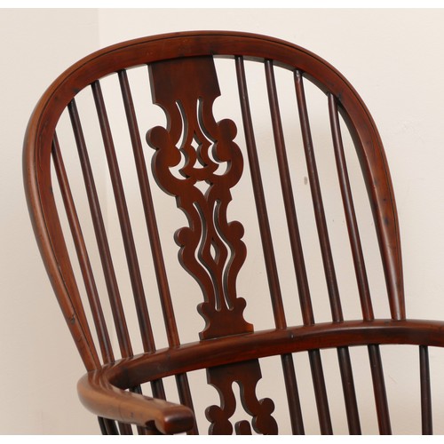 499 - A yew and elm windsor chair, circa 18th century, the pierced shaped splat and stick back, with hoop ... 