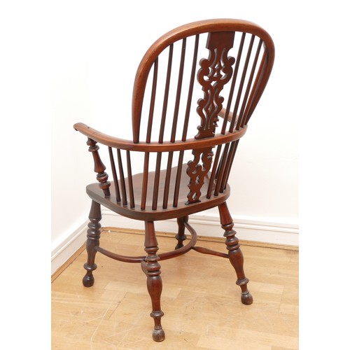 499 - A yew and elm windsor chair, circa 18th century, the pierced shaped splat and stick back, with hoop ... 