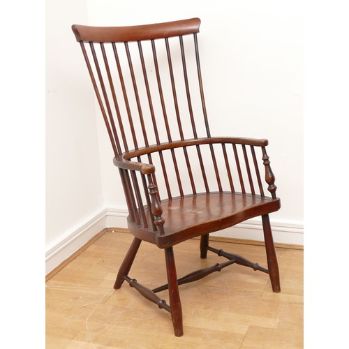 500 - A 19th century highback darvel armchair, the shaped top rail over comb back hoop arms with baluster ... 