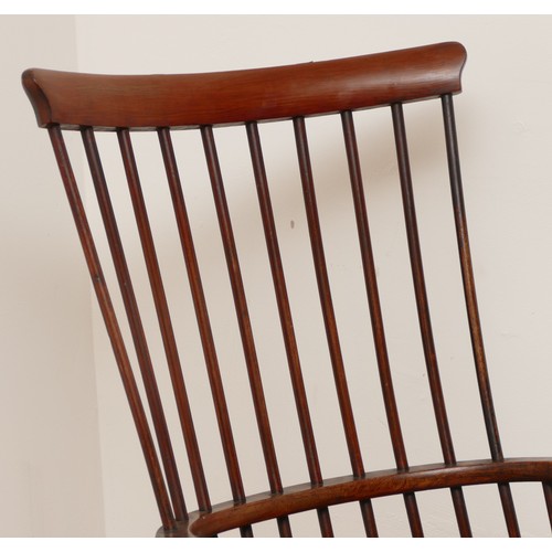 500 - A 19th century highback darvel armchair, the shaped top rail over comb back hoop arms with baluster ... 