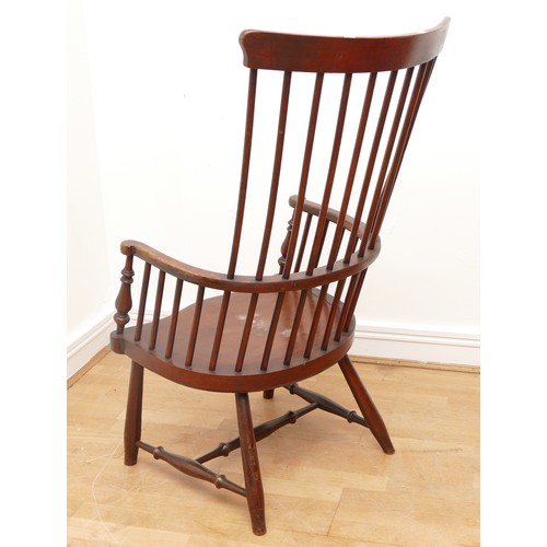 500 - A 19th century highback darvel armchair, the shaped top rail over comb back hoop arms with baluster ... 