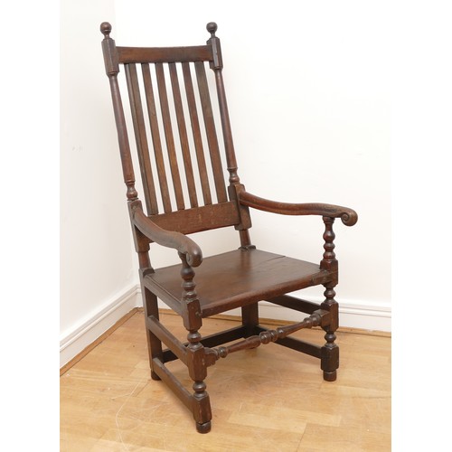 501 - A 17th century and later oak throne armchair, the slat back with inset solid seat, scroll arms on sq... 