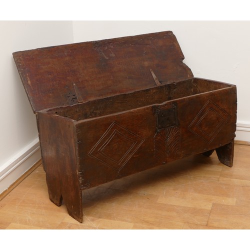 503 - A 17th century oak bible box, the sloped top with incised concentric roundels to the top above carve... 