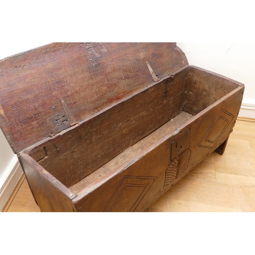 503 - A 17th century oak bible box, the sloped top with incised concentric roundels to the top above carve... 