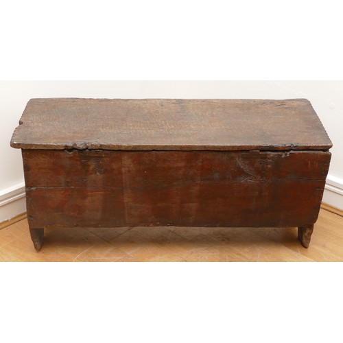 503 - A 17th century oak bible box, the sloped top with incised concentric roundels to the top above carve... 