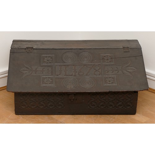 507 - 17th century oak bible box, the sloped top with iron mounts and lock, opening to compartment with a ... 