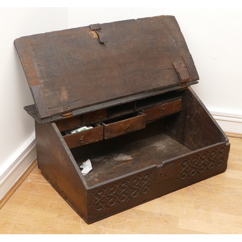 507 - 17th century oak bible box, the sloped top with iron mounts and lock, opening to compartment with a ... 