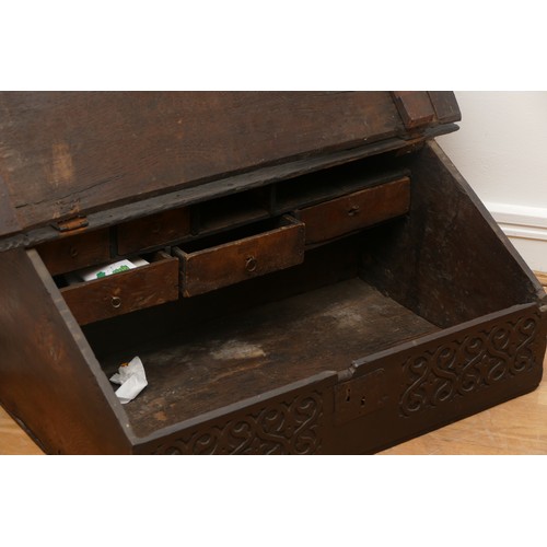 507 - 17th century oak bible box, the sloped top with iron mounts and lock, opening to compartment with a ... 