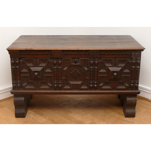 508 - A 19th century Spanish or Portuguese oak chest, the rectangular top with moulded edges over carved f... 