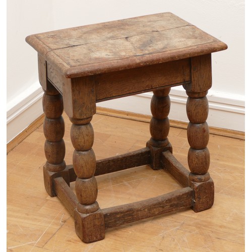 510 - A late 18th century oak jointed stool, the rectangular top with moulded edge, turned supports with l... 