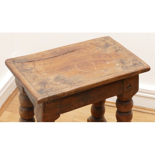 511 - A late 18th century oak jointed stool, the rectangular top with moulded edge, turned supports with l... 