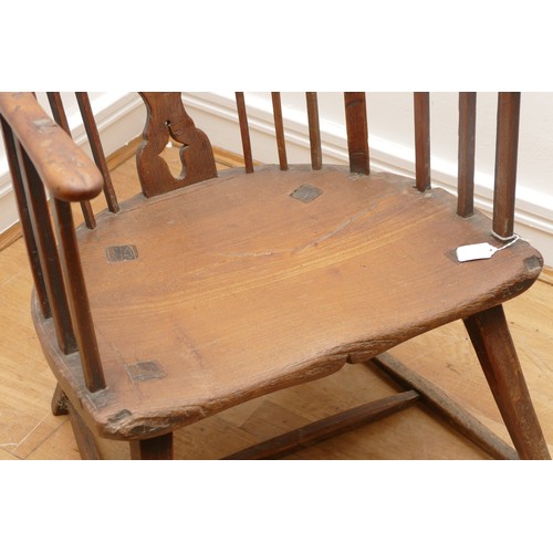 512 - An 18th Century ash primitive shawl back Windsor chair, West Country, the arched top rail above a sp... 