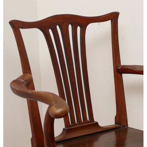 513 - A 19th century oak splat back armchair, having scrolled carved armrests over inset solid seat on squ... 