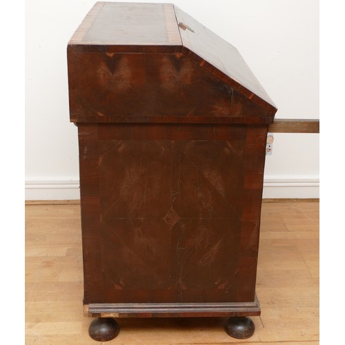 514 - A 17th century laburnum bureau, oyster veneered with walnut cross banding, the overhanging slope wit... 