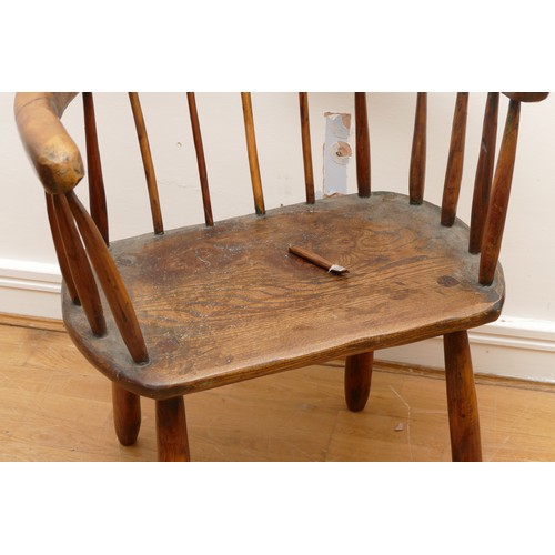 516 - An 18th century Welsh primitive stick chair, elm seat with three holes to the top rail, 60cm across ... 