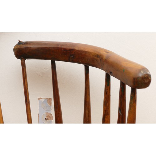 516 - An 18th century Welsh primitive stick chair, elm seat with three holes to the top rail, 60cm across ... 