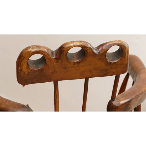 516 - An 18th century Welsh primitive stick chair, elm seat with three holes to the top rail, 60cm across ... 